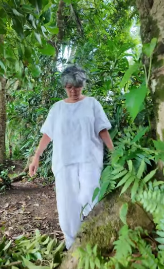 helen walking through rainforest<br />

